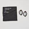Rattle Earrings by George Sowden for Acme Studio sold by the modern archive